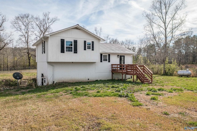 view of front of house with stairs and a front lawn