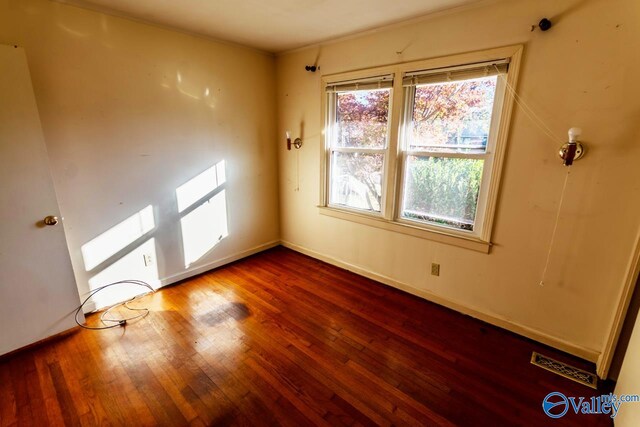 empty room featuring hardwood / wood-style floors