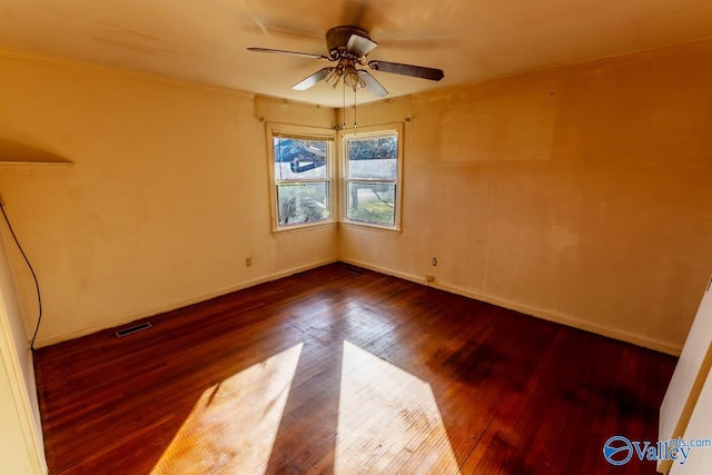 unfurnished room with hardwood / wood-style floors, ceiling fan, and crown molding