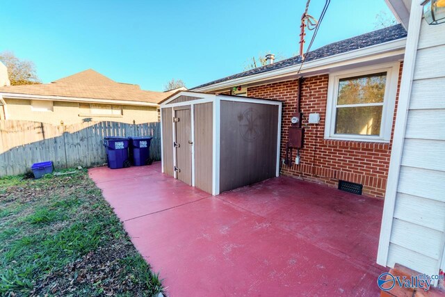 view of patio with a storage unit