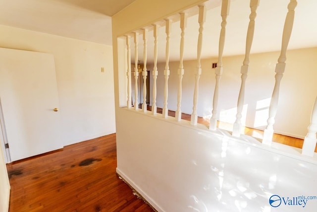 stairs featuring wood-type flooring