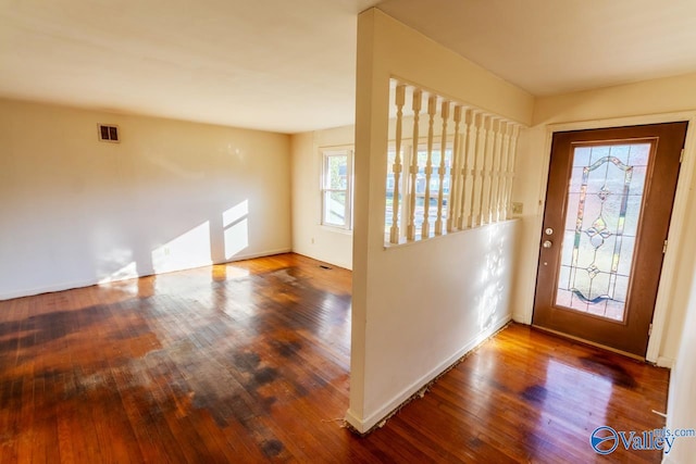 entryway with dark hardwood / wood-style floors