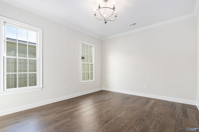 unfurnished room featuring ornamental molding, a chandelier, and dark hardwood / wood-style flooring