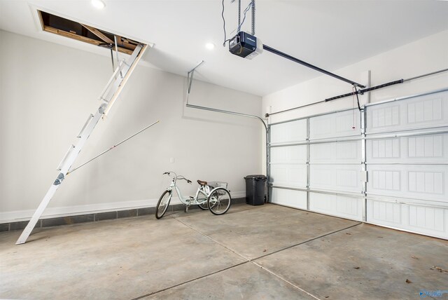 garage featuring a garage door opener