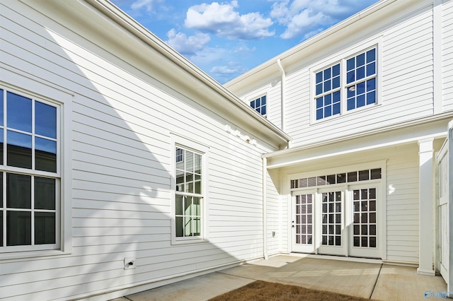 property entrance with french doors and a patio area