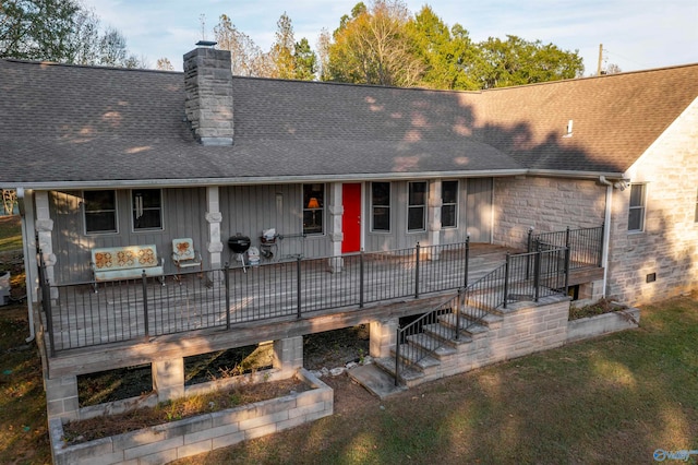 rear view of property with a deck