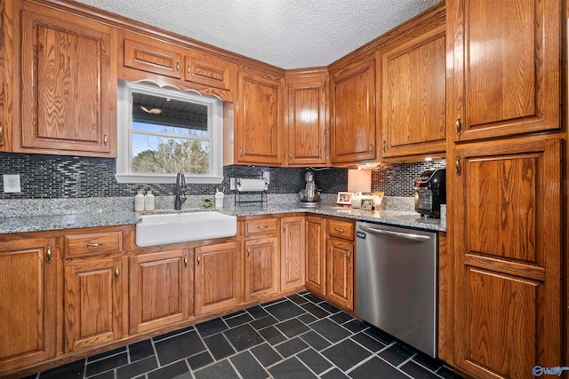 kitchen featuring dishwasher, tasteful backsplash, light stone countertops, and sink