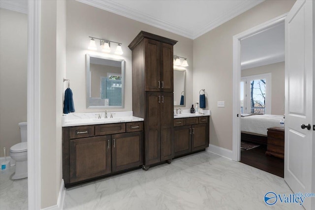 bathroom featuring crown molding, vanity, and toilet