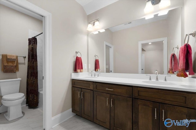 full bathroom with vanity, toilet, and shower / tub combo with curtain