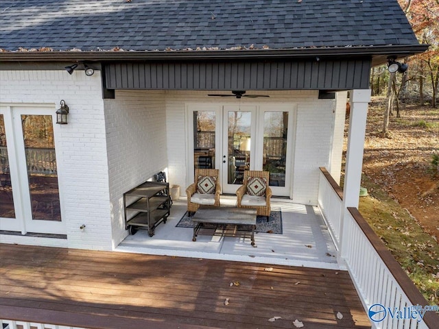 wooden terrace with ceiling fan and french doors