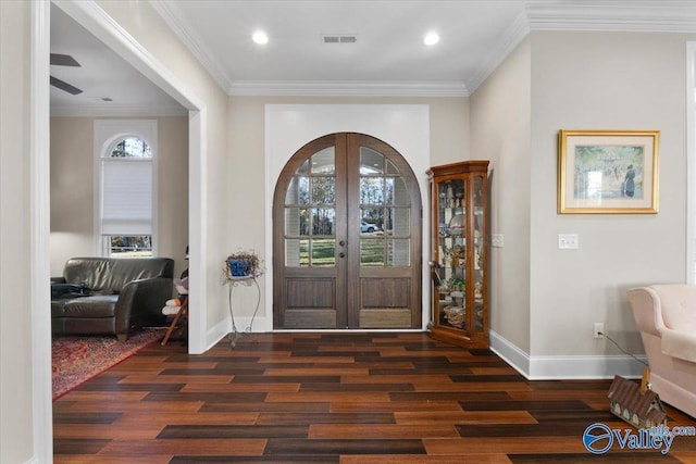 entrance foyer with french doors, dark hardwood / wood-style flooring, and plenty of natural light