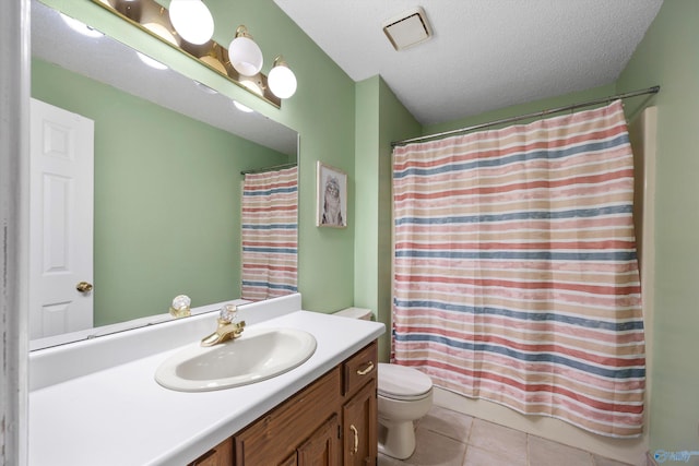 bathroom with toilet, a textured ceiling, vanity, curtained shower, and tile patterned flooring