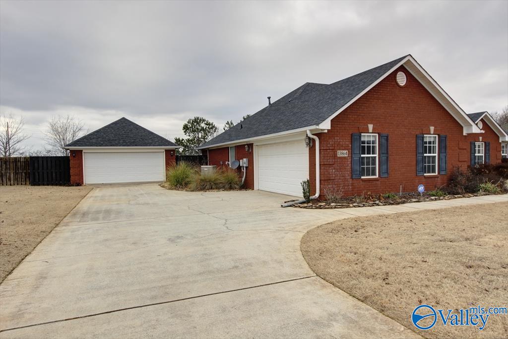 ranch-style house featuring a garage