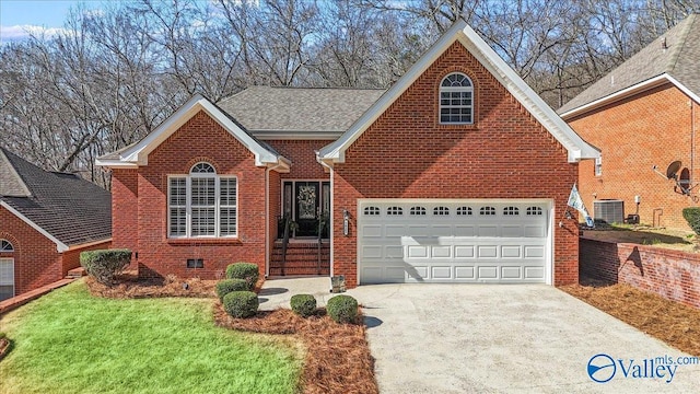 traditional-style home featuring a garage, driveway, cooling unit, crawl space, and brick siding