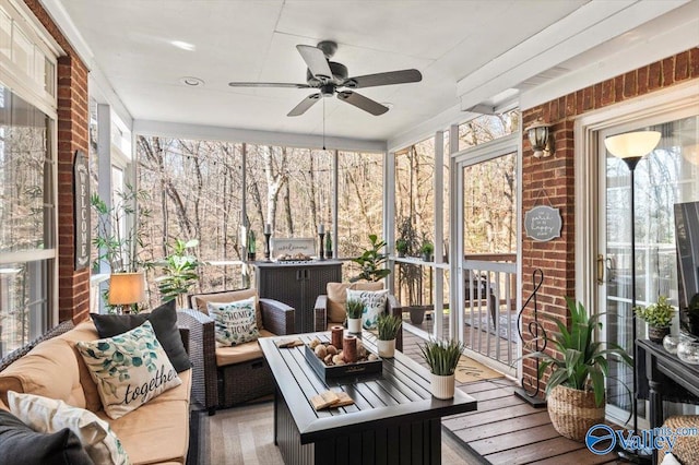 sunroom with a ceiling fan