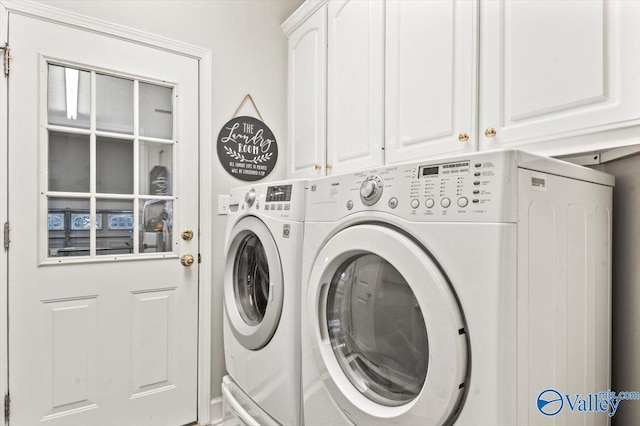 laundry room with cabinet space and independent washer and dryer