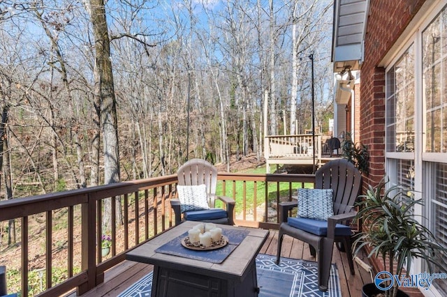 deck with a wooded view