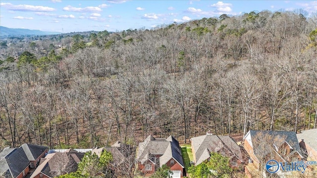 birds eye view of property with a residential view and a forest view