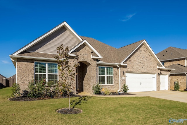 view of front of home featuring a garage and a front lawn