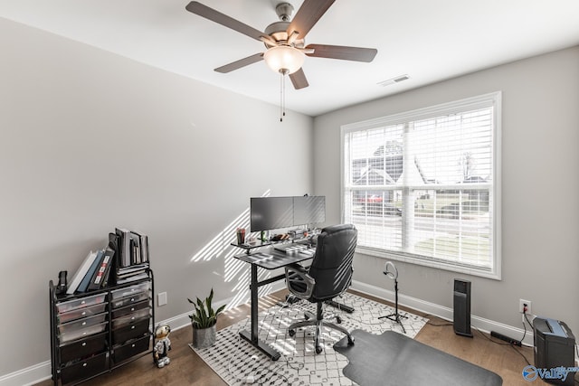 office space with hardwood / wood-style flooring and ceiling fan