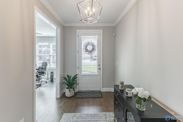 doorway to outside featuring a chandelier, dark hardwood / wood-style floors, and crown molding