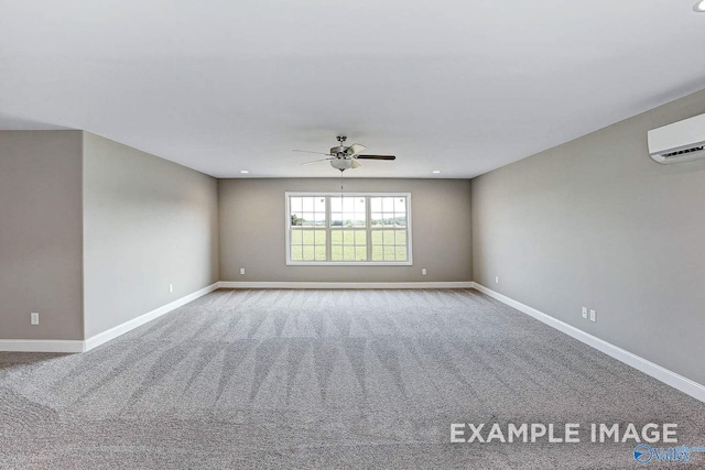 carpeted spare room featuring a wall mounted air conditioner and ceiling fan