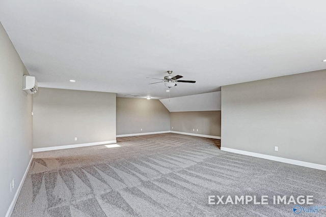 unfurnished room featuring an AC wall unit, ceiling fan, carpet flooring, and lofted ceiling