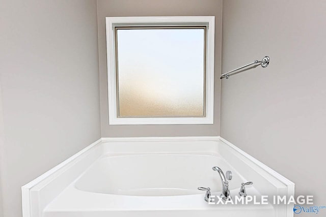 bathroom featuring a tub to relax in