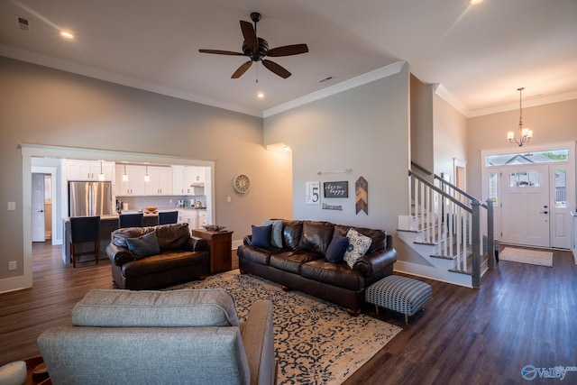25366 Nettlebrooke Dr, Athens, AL 35613 - living room with stairway, a high ceiling, dark wood-style floors, visible vents, and baseboards