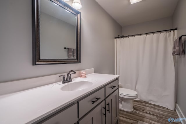 25366 Nettlebrooke Dr, Athens, AL 35613 - full bathroom with toilet, vanity, and wood finished floors