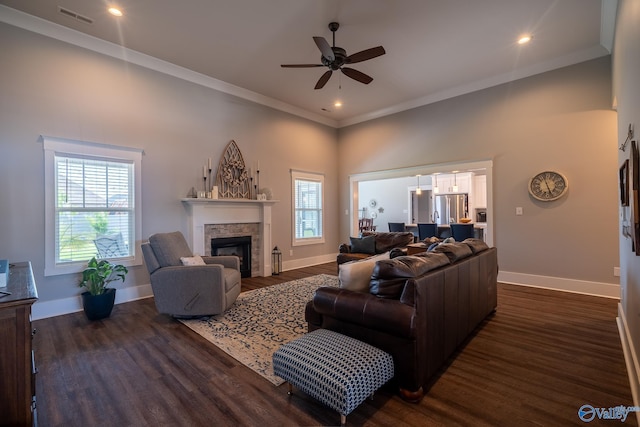 25366 Nettlebrooke Dr, Athens, AL 35613 - living room with a ceiling fan, visible vents, a fireplace, baseboards, and dark wood-style floors