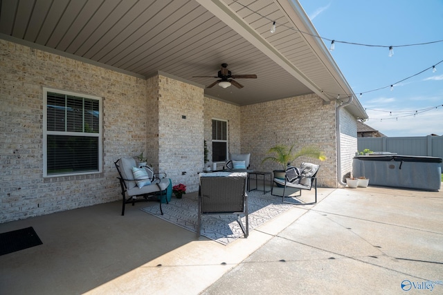 25366 Nettlebrooke Dr, Athens, AL 35613 - view of patio / terrace with an outdoor living space, a hot tub, a ceiling fan, and fence