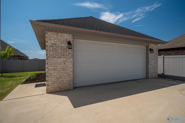 25366 Nettlebrooke Dr, Athens, AL 35613 - garage featuring driveway and fence