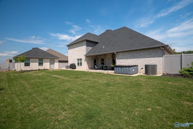 25366 Nettlebrooke Dr, Athens, AL 35613 - rear view of property with central AC, a hot tub, a patio, and a fenced backyard