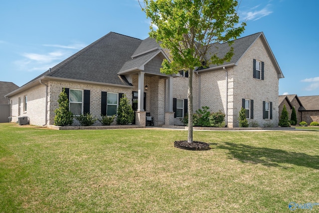 25366 Nettlebrooke Dr, Athens, AL 35613 - view of front of home featuring brick siding, roof with shingles, and a front yard