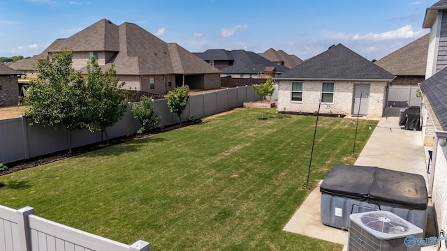 25366 Nettlebrooke Dr, Athens, AL 35613 - view of yard with a residential view, a fenced backyard, central AC, a hot tub, and a patio