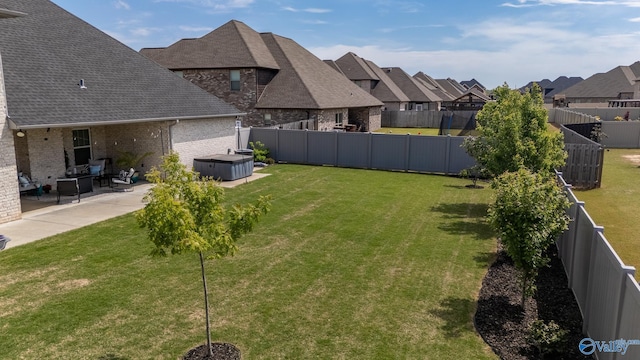 25366 Nettlebrooke Dr, Athens, AL 35613 - view of yard featuring a residential view, a fenced backyard, a hot tub, and a patio
