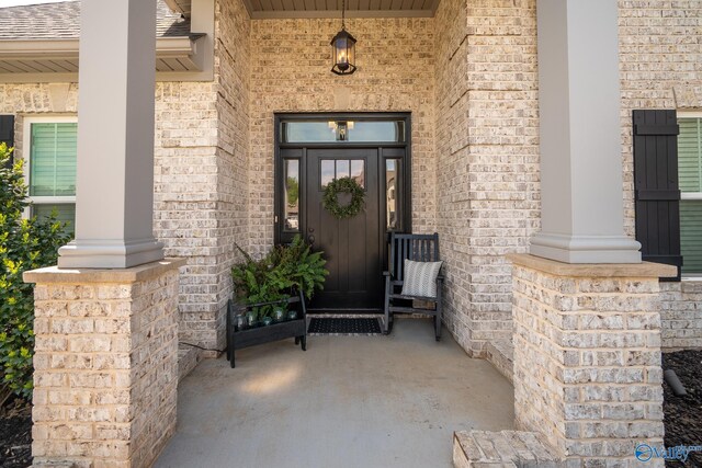 25366 Nettlebrooke Dr, Athens, AL 35613 - entrance to property with a shingled roof, covered porch, and brick siding