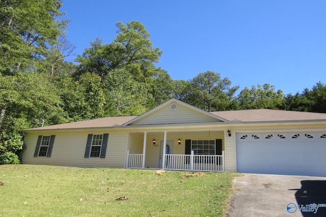 ranch-style house with a front yard, a garage, and covered porch