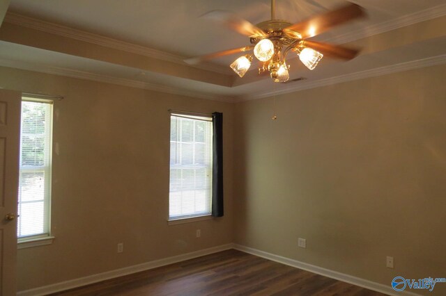 unfurnished room with ceiling fan, dark hardwood / wood-style flooring, and a healthy amount of sunlight