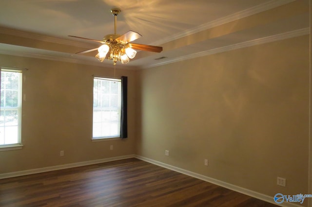 spare room featuring ornamental molding, ceiling fan, and dark wood-type flooring