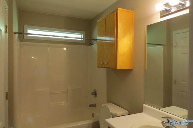 full bathroom featuring shower / bath combination, sink, and toilet