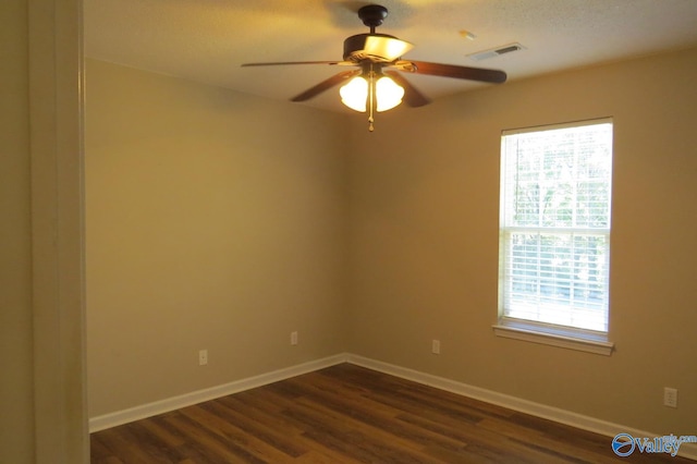 empty room featuring dark hardwood / wood-style floors and ceiling fan