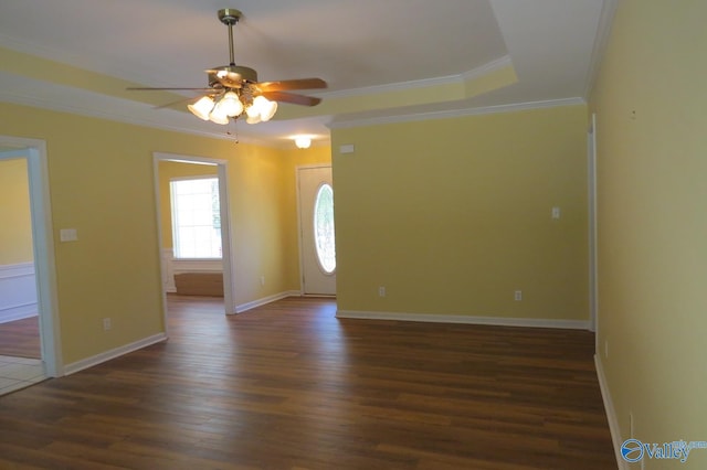 empty room featuring ornamental molding, ceiling fan, and dark hardwood / wood-style floors