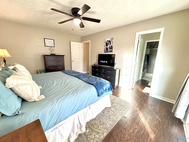 bedroom with ceiling fan and a textured ceiling