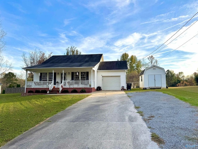 ranch-style house with a porch, a shed, a front lawn, and a garage