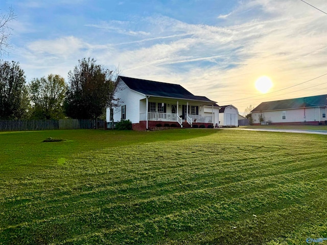 exterior space featuring a porch and a lawn