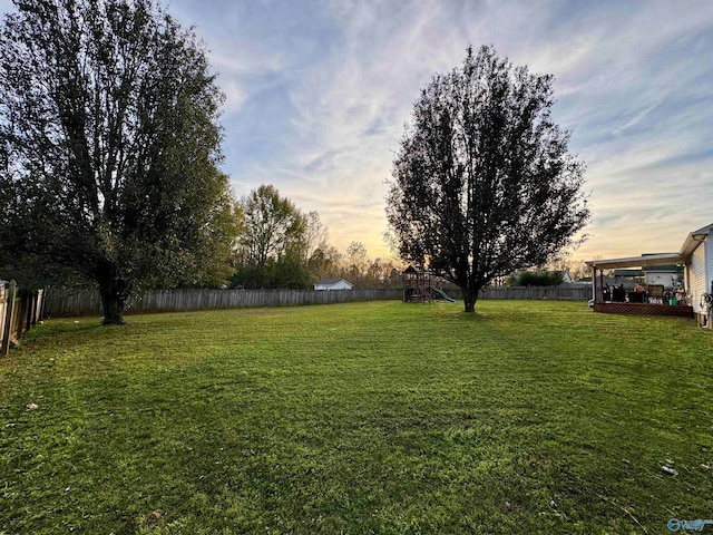 view of yard at dusk