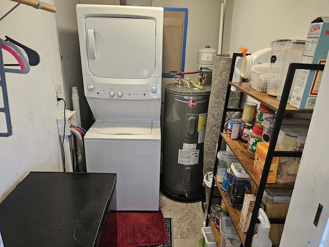 laundry room featuring stacked washer / dryer and water heater