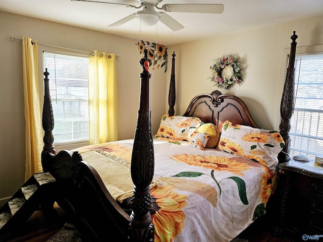 bedroom featuring multiple windows and ceiling fan